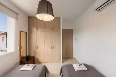a bedroom with two beds and a large window at The Second Diamond Protara - 2' Walk to Beach in Protaras
