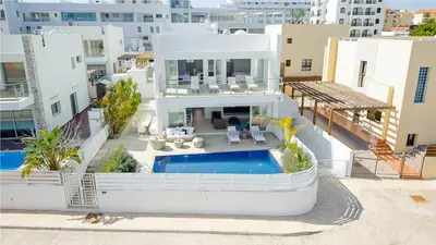 an aerial view of a house with a swimming pool at Protaras Holiday Villa 100 in Protaras