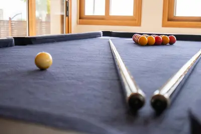 a pool table with two cue balls on it at Konnos Villa 1 in Protaras
