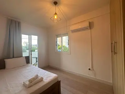 a bedroom with a bed with two towels on it at Appartments 750m from beach, tourist area in Limassol