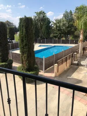 a view of a swimming pool from a balcony at A+A Apartment in Kiti
