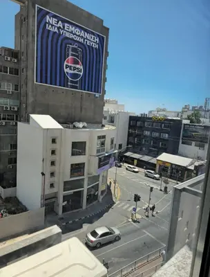 a building with a sign on the side of it at The Heart of the City in Limassol