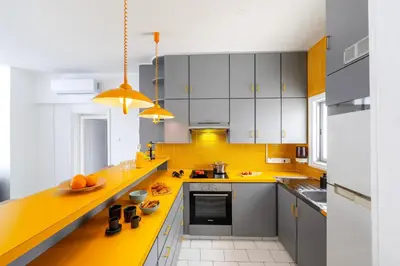 a kitchen with yellow counters and a yellow counter top at Protaras O2 Seaside Suite in Protaras