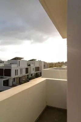 a view from the balcony of a white building at Hubstay - Seaview Villa Oriana in Larnaca in Larnaka