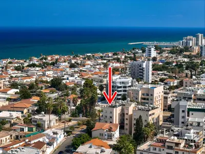 an aerial view of a city with a red arrow at Large apartment close to Finikoudes Beach with 2 balconies in Larnaka
