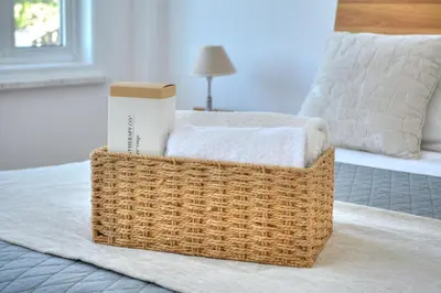 a wicker basket sitting on top of a bed at Villa Aquamarine in Ayia Napa