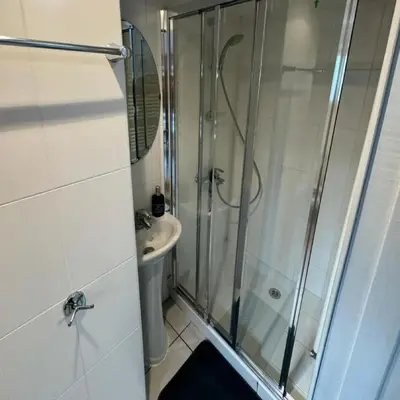 a bathroom with a shower and a sink at Maryland River Liz in Kakopetria