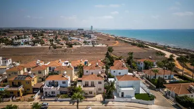 an aerial view of a village next to the ocean at Mermaid Villa 16 in Ayia Napa