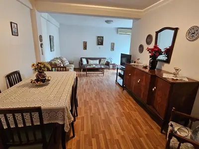 a living room with a table and a couch at Beautiful Apartment in Center of Nicosia with views in Nicosia