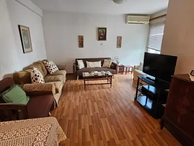 a living room with a couch and a tv at Beautiful Apartment in Center of Nicosia with views in Nicosia