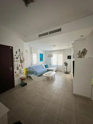 a living room with a couch and a table at Villa Serenity in Protaras
