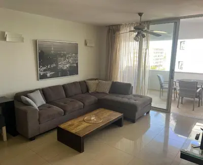 a living room with a couch and a coffee table at Superb Seaview Flat, Prime Area in Larnaka