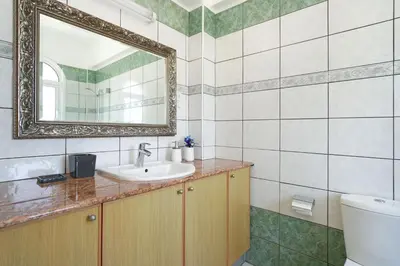 a bathroom with a sink and a mirror at Villa Angelina - 300m from Kapparis beach in Paralimni
