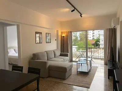 a living room with a couch and a table at Cozy 1 BDR in Nicosia city center - Aiantos By Platform 357 in Strovolos