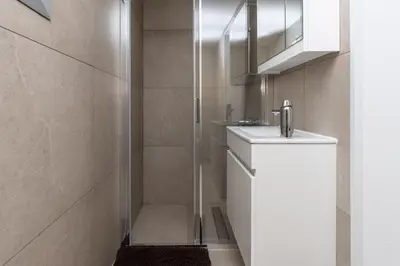 a bathroom with a sink and a shower at Mediterranean Oasis Protaras in Protaras