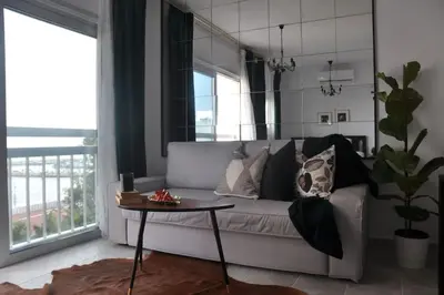 a living room with a couch and a table at Aria Sea View Studio in Larnaka