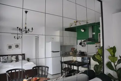 a kitchen and dining room with a table and chairs at Aria Sea View Studio in Larnaka