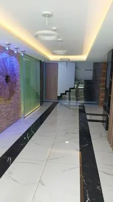 a hallway of a building with a long hallway with a painting at Balcony Sea View Whole Apt, Minutes To Beach in Limassol