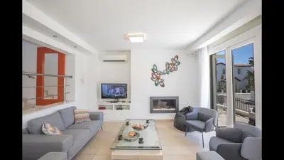 a living room with two couches and a tv at Protaras Katerina Villa Kv53 in Paralimni