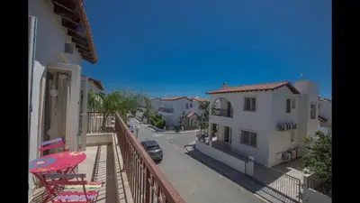 a balcony with a view of a street and buildings at Protaras Katerina Villa Kv53 in Paralimni