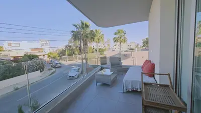 a balcony with a view of a city street at STAY Digital Den Apartment in Larnaka