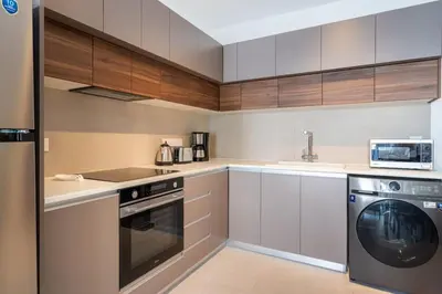 a kitchen with a washer and a dishwasher at Hazel - 2-Bedroom Apartment in Larnaca in Larnaka