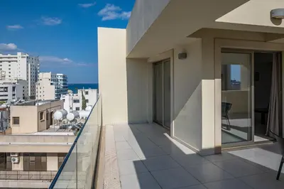 a balcony with a view of the city at Downtown 2 Bedroom Penthouse in Larnaka