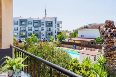 a view of the pool from the balcony of a hotel at Lazuli Stylish 1-BR Apt W Pool & Balcony in Larnaca in Voroklini