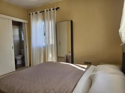 a bedroom with a bed and a large mirror at The Brilliant Villa in Protaras