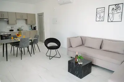 a living room with a couch and a table at Nissi Route 76 in Ayia Napa