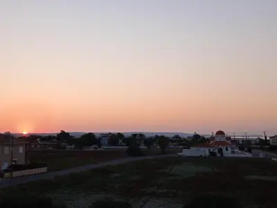 a sunset from the roof of a building at Xylophagou Larnaca Ayia Napa Sunshine Apartments in Xylophaghou