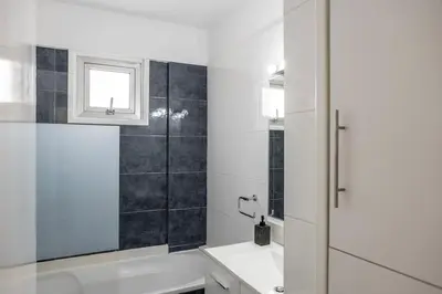 a bathroom with a shower and a sink at Luxurious Bright & Stylish 2BR with Office in Nicosia in Nicosia