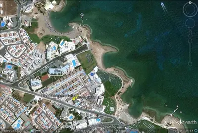a map of a resort next to the water at Aphrodite Sea View Suite in Protaras