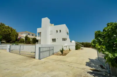 a white house with a fence in front of it at Villa Christina in Ayia Napa