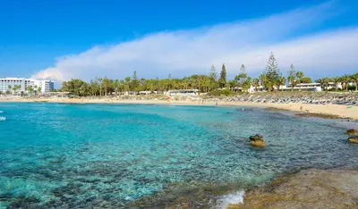 a beach with a group of people in the water at Villa Sarah in Ayia Napa