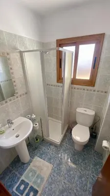 a bathroom with a toilet and a shower and a sink at Villa Annalisarose in Ayia Napa