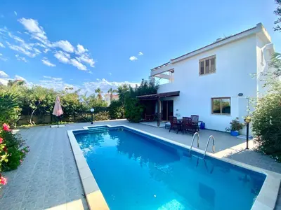 a swimming pool in the backyard of a house at Villa Annalisarose in Ayia Napa
