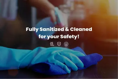 a person with a cleaning glove on a table at Serenity Waves Villa 10 in Sophtadhes