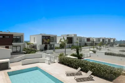 an aerial view of a building with a swimming pool at Serenity Waves Villa 9 in Sophtadhes