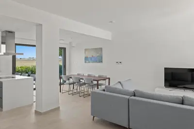 a living room with a couch and a table at Serenity Waves Villa 9 in Sophtadhes