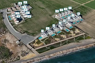 an aerial view of a resort complex next to the water at Serenity Waves Villa 3 in Sophtadhes