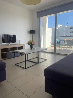a living room with a coffee table and a couch at Fig Tree View Apartments in Protaras