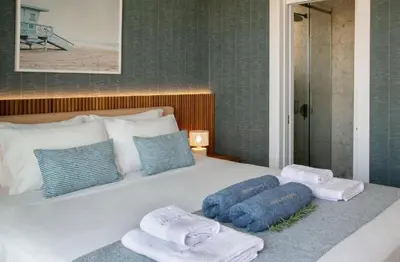 a bedroom with a bed with towels on it at Magnificent Protaras Villa Villa Chelsea 3 Bedrooms Private Outdoor Pool in Protaras