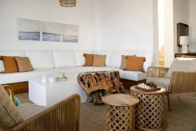 a living room with a couch and a table at Magnificent Protaras Villa Villa Chelsea 3 Bedrooms Private Outdoor Pool in Protaras