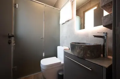 a bathroom with a sink and a toilet at Exotic Sea Boutique Adults Only in Protaras