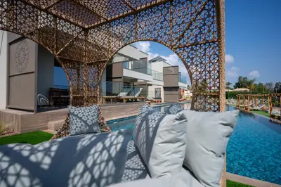 a pergola over a pool at a resort at Exotic Sea Boutique Adults Only in Protaras