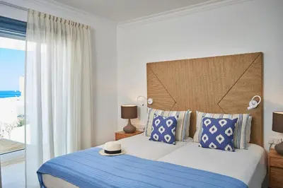 a bedroom with a large bed with a blue blanket at Luxury Protaras Villa Villa Najenda 3 Bedrooms Private Outdoor Pool in Protaras