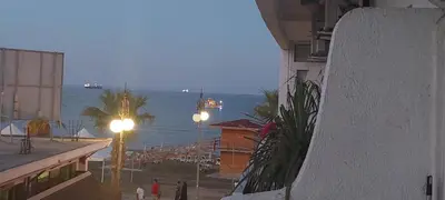 a view of the ocean from a balcony of a building at Paradise by the Sea in Larnaka