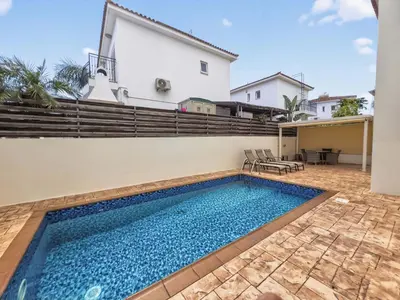 a swimming pool in the backyard of a house at Villa Ioli - 3BR Retreat near Kalamies Beach in Protaras