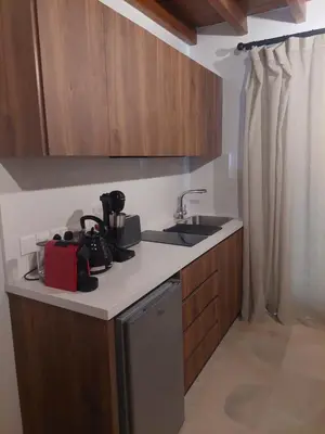 a kitchen with a sink and a counter top at AROMA DRYOS in Kato Drys